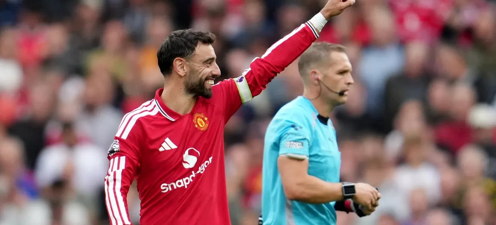 Bruno Fernandes celebrating with referee during match