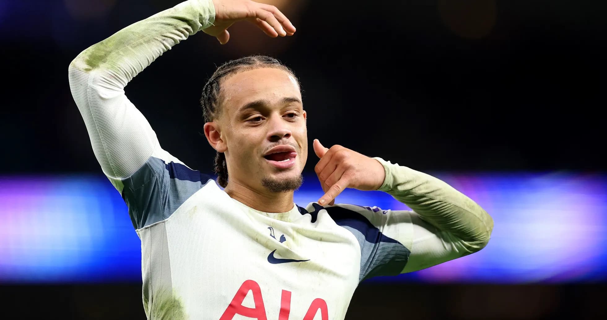 Player celebrating with phone gesture after scoring
