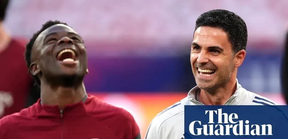 Arsenal players laughing during a training session