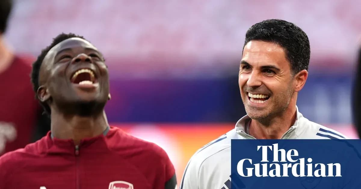 Arsenal players laughing during a training session