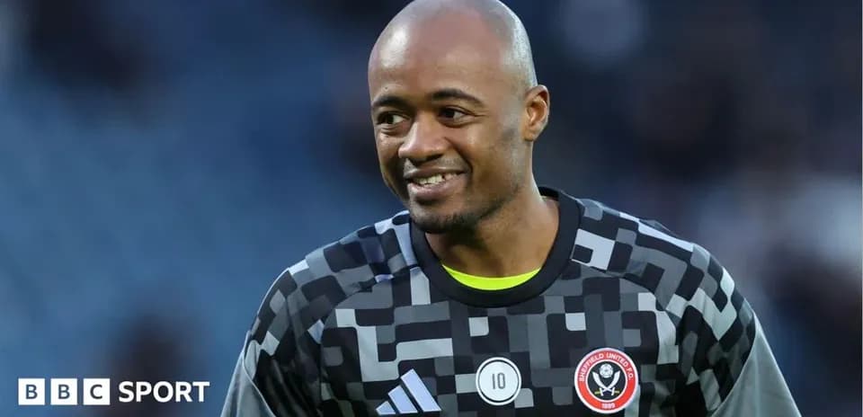 Goalkeeper smiling during warm-up at stadium