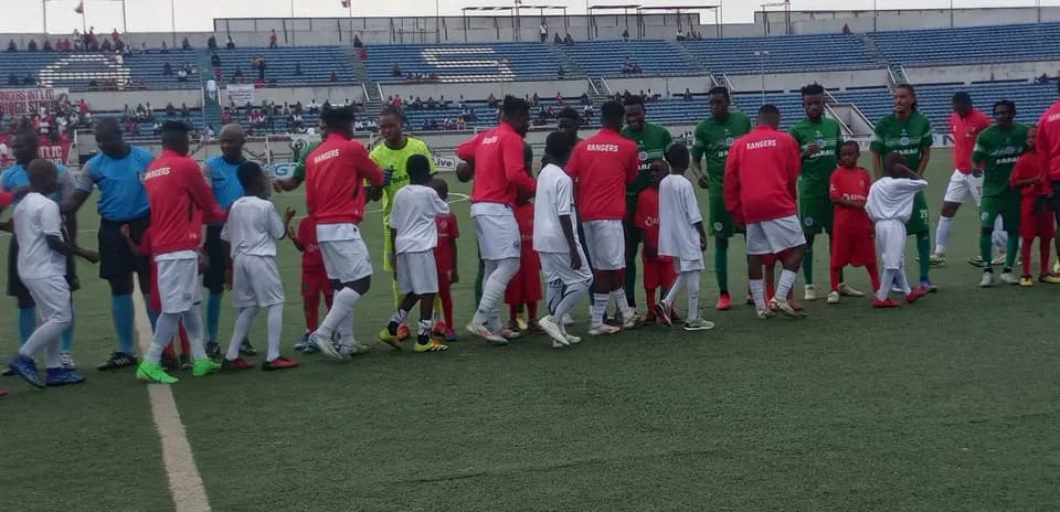 Players from Barau FC and Enugu Rangers shaking hands