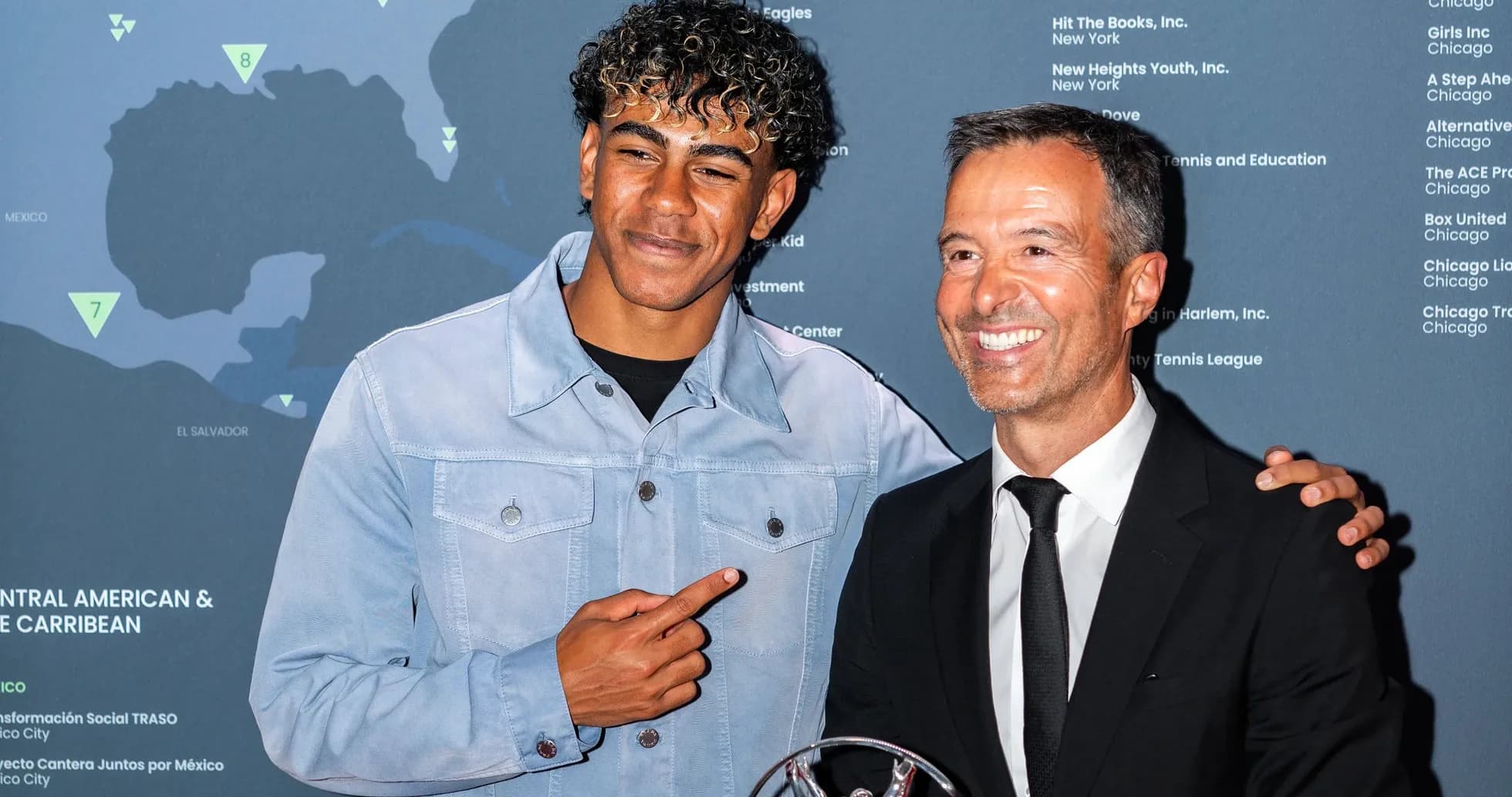 Two men posing together at an event
