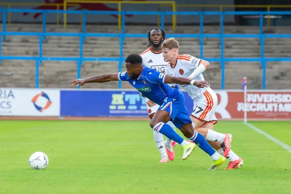 Player in blue shirt diving for the ball