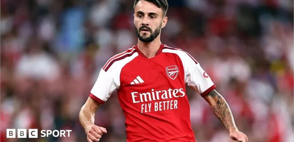 Player in Arsenal kit during match celebration