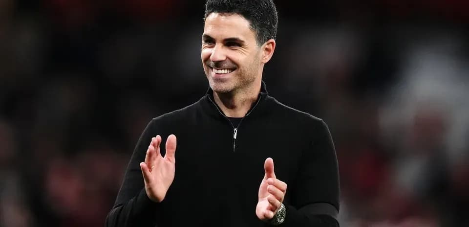 Coach applauding during a match at the stadium