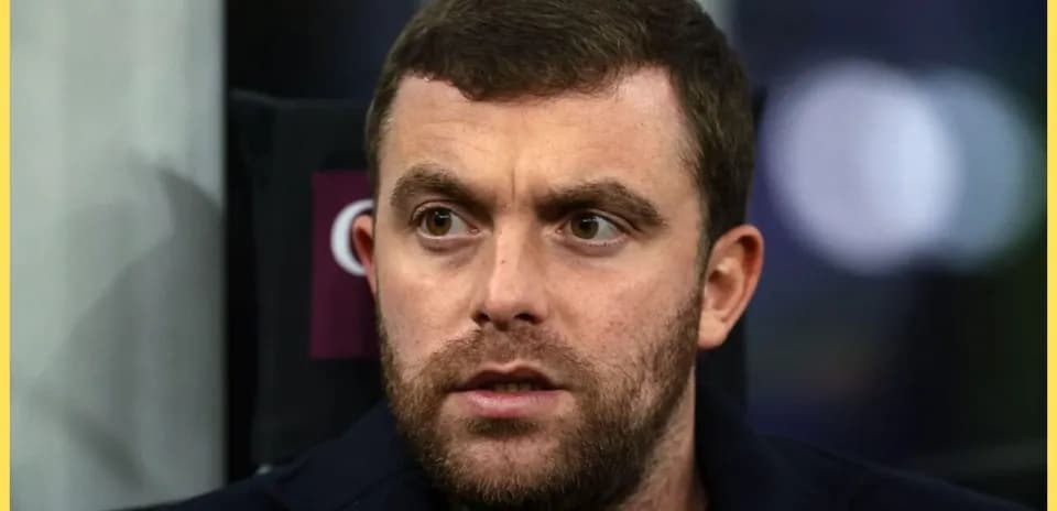Close-up of a man with a beard and serious expression