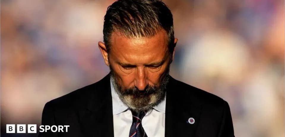 Manager with head down during match preparation