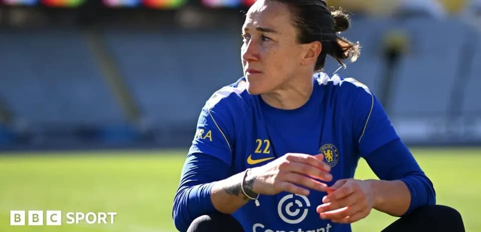 Player in blue Chelsea kit sitting on pitch