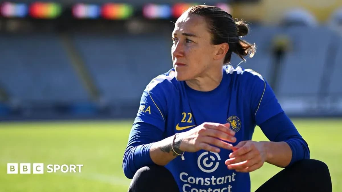 Player in blue Chelsea kit sitting on pitch