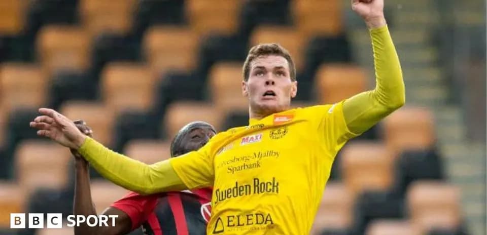 Player jumping to challenge for the ball during match