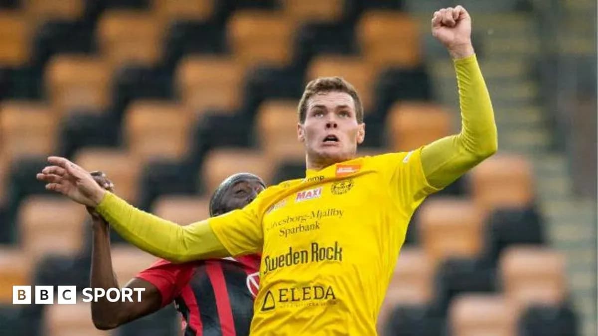 Player jumping to challenge for the ball during match
