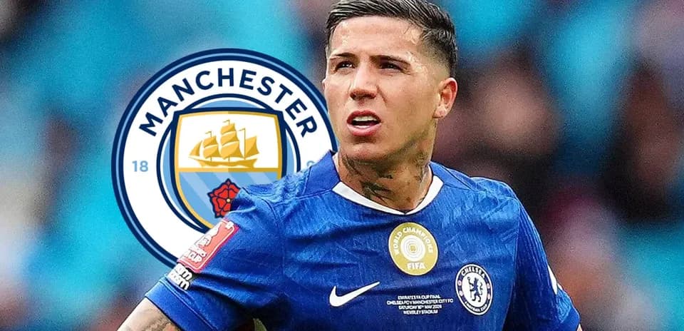 Player in Chelsea kit with Manchester City logo backdrop