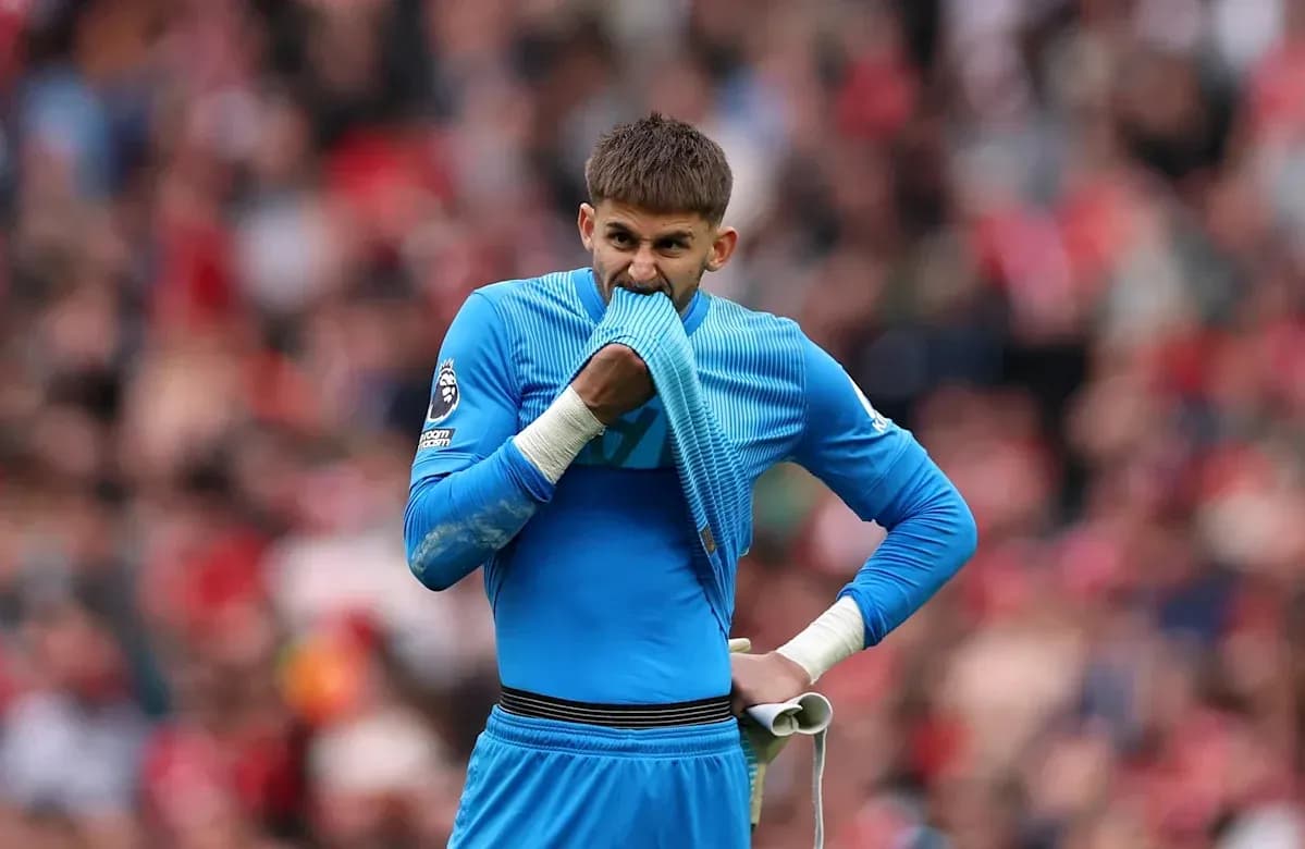 Goalkeeper biting his jersey during match