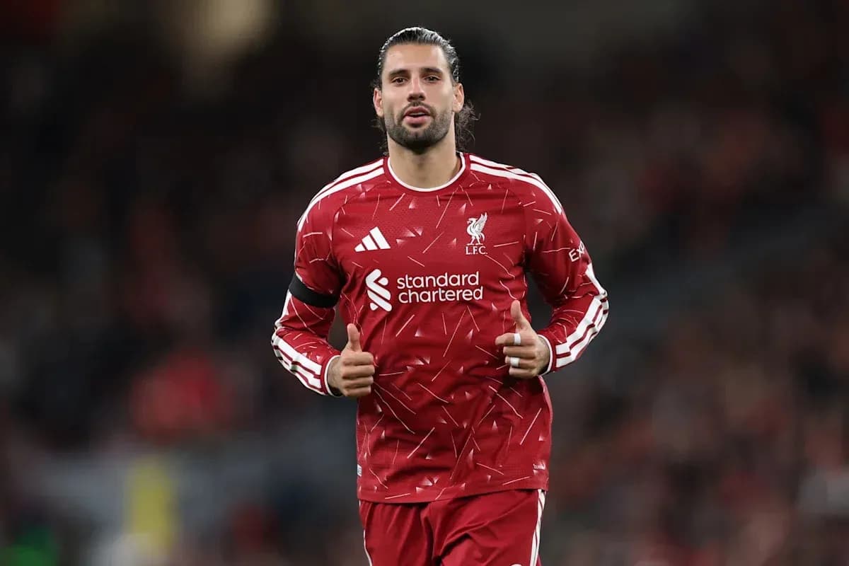 Player in Liverpool kit giving thumbs up