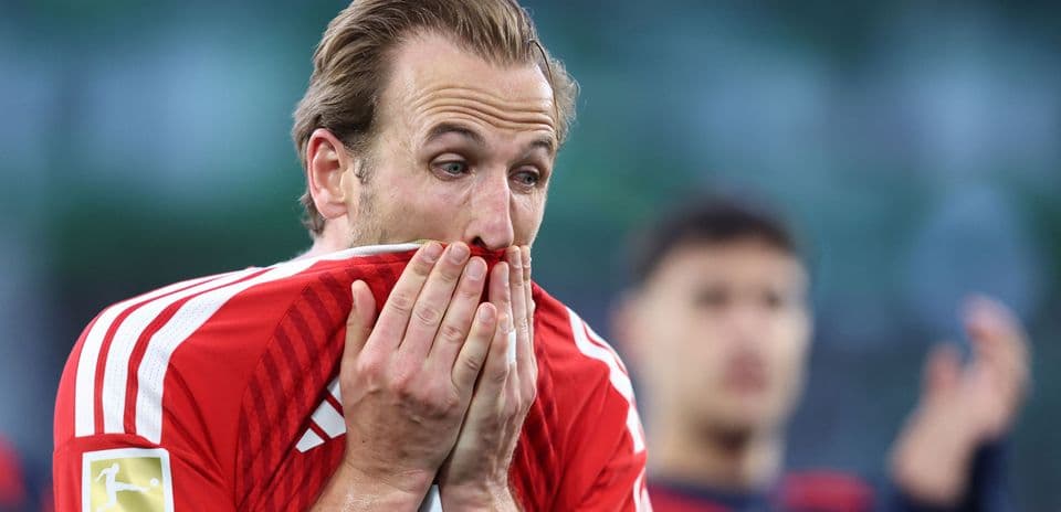 Player covering face with jersey during match