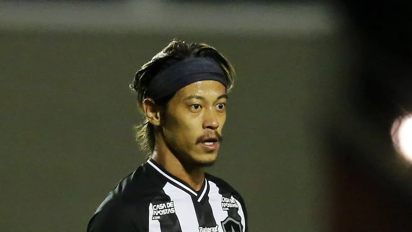 Player in black and white jersey on field