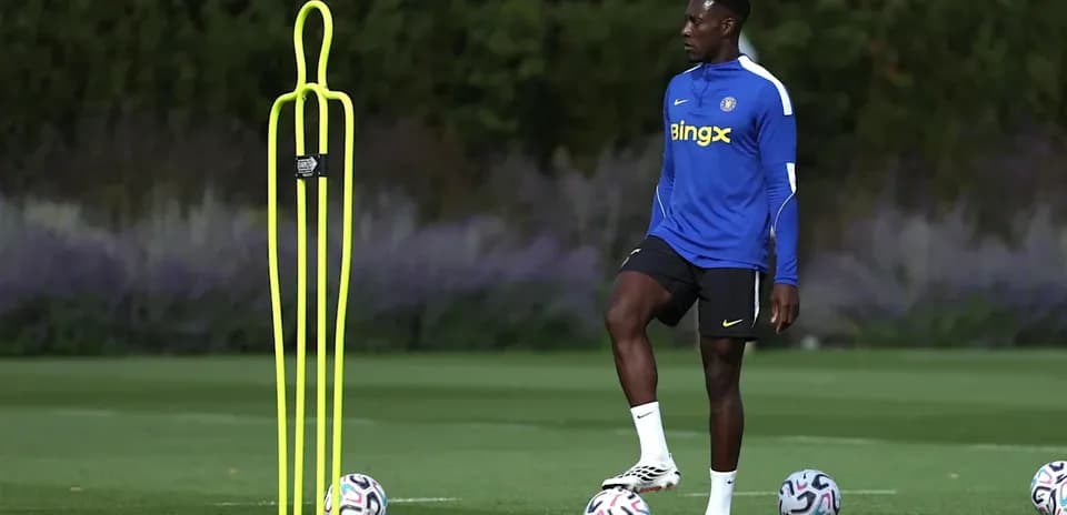 Player practicing next to training cones and balls