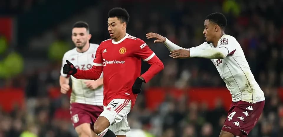 Jesse Lingard dribbling past opponent during match
