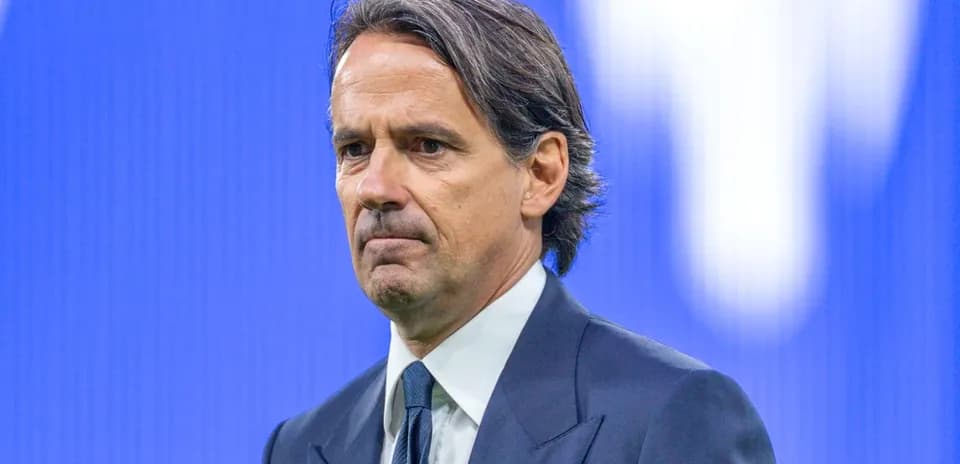 Coach in formal attire during press event