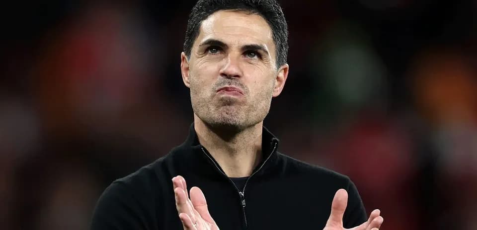 Coach applauding during post-match celebration