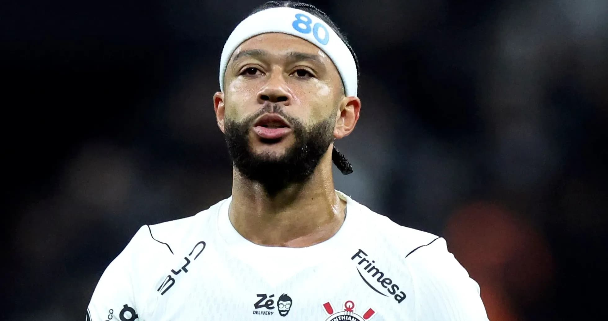 Player in white jersey with headband during match