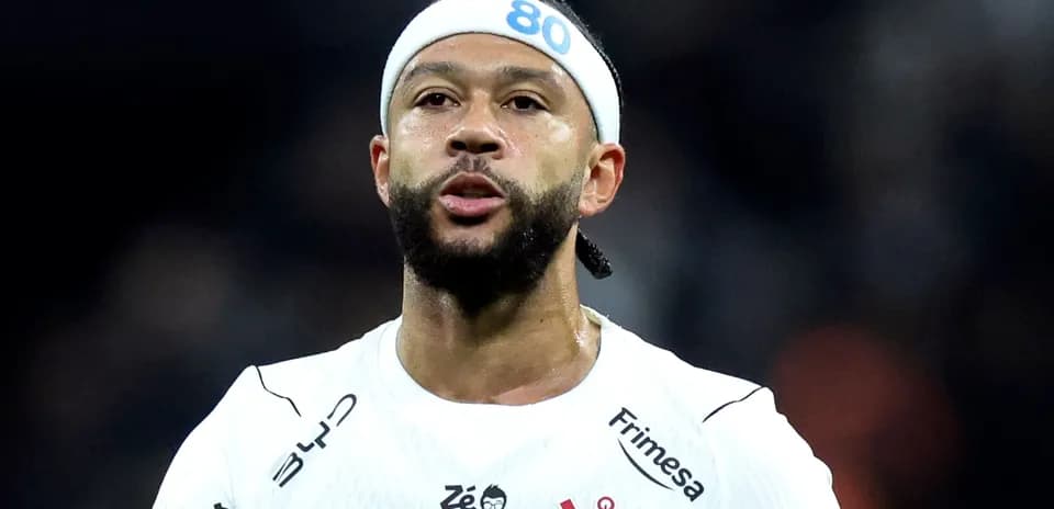 Player in white jersey with headband during match