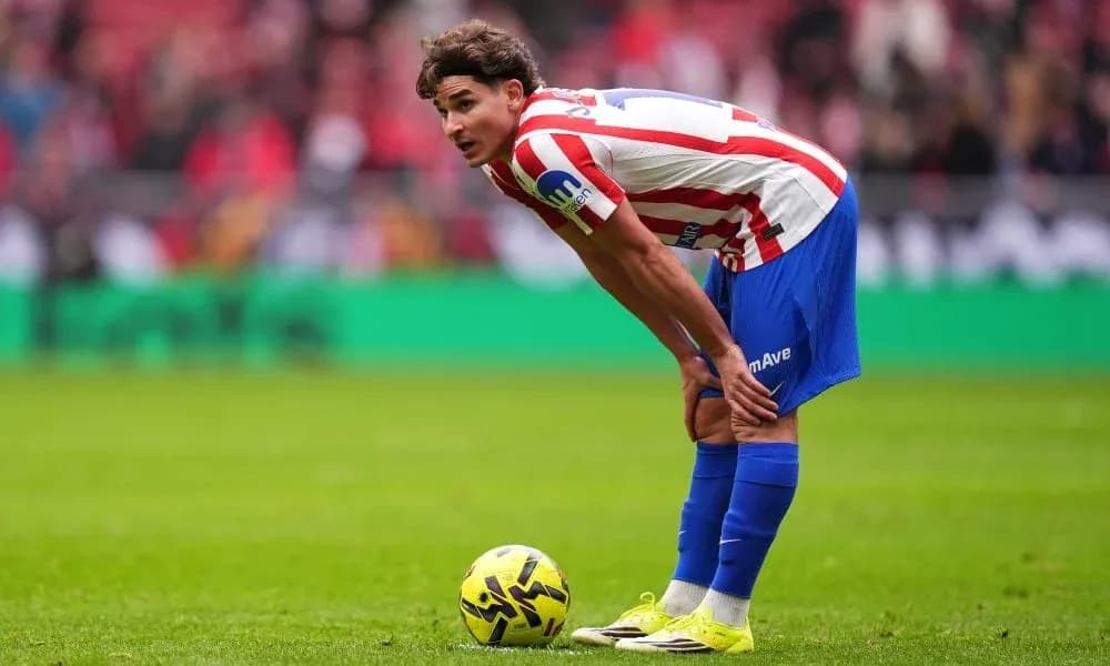 Player preparing for a free kick on field