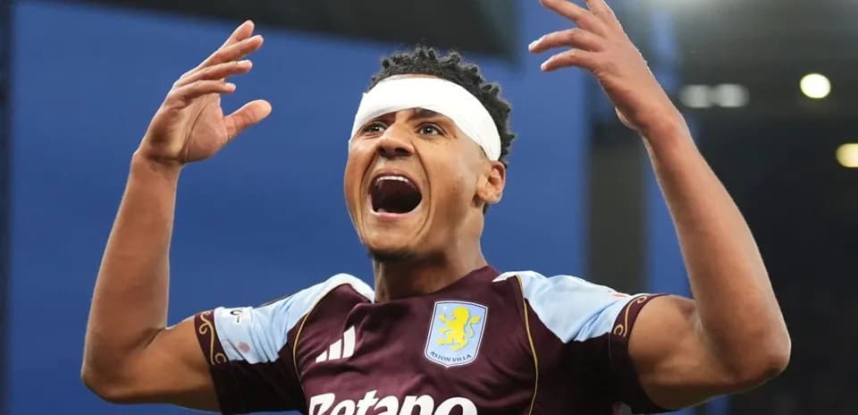Player celebrating with arms raised after scoring