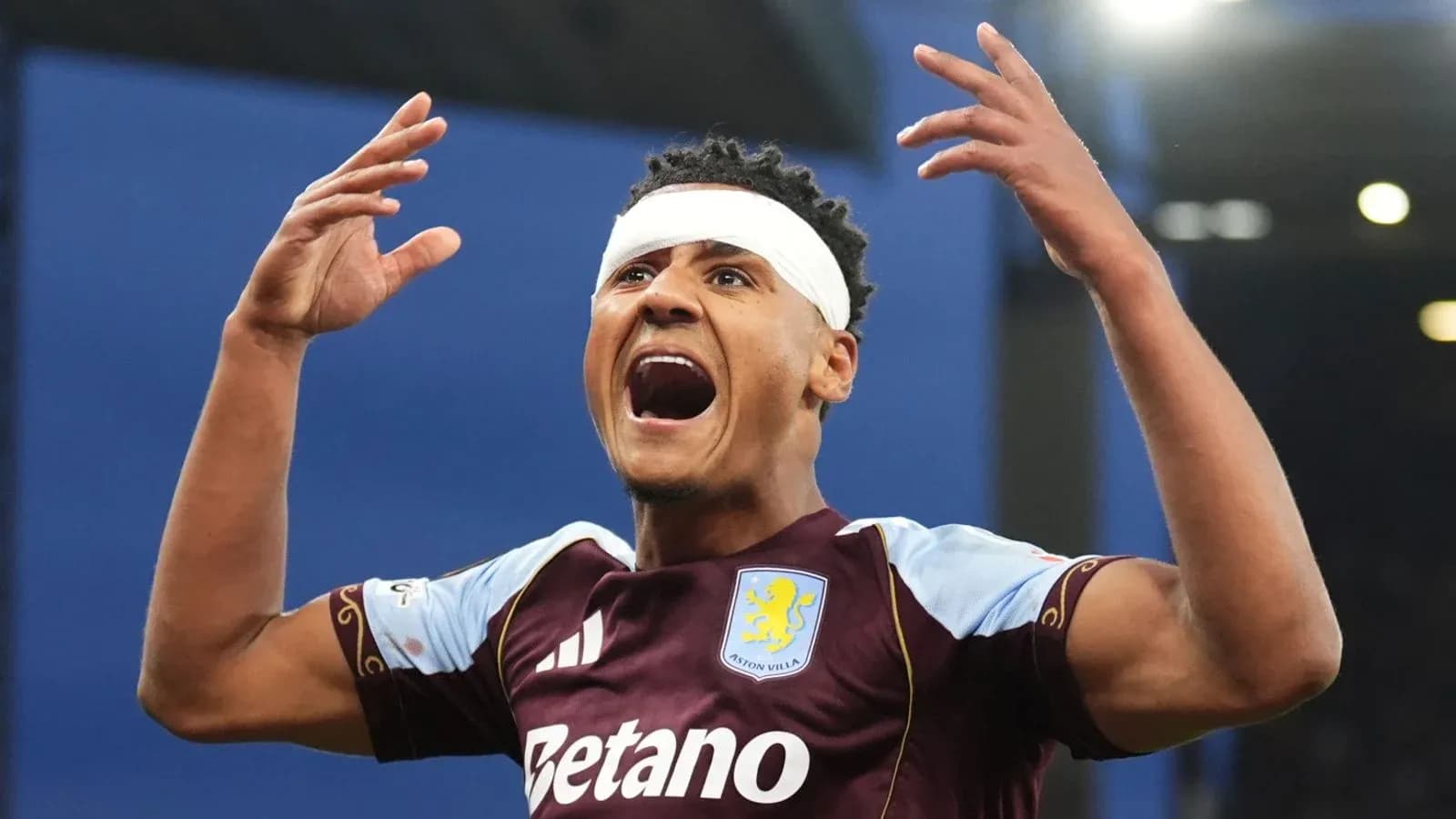 Player celebrating with arms raised after scoring