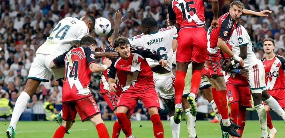 Players contesting a corner kick during match