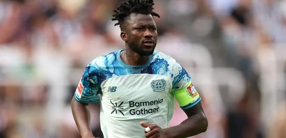 Player in action wearing team jersey on field