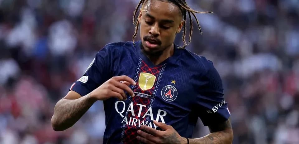 Player adjusting jersey during match for Paris Saint-Germain