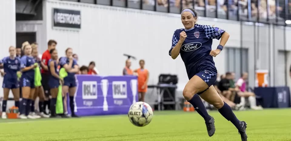 Player running with ball during USL match