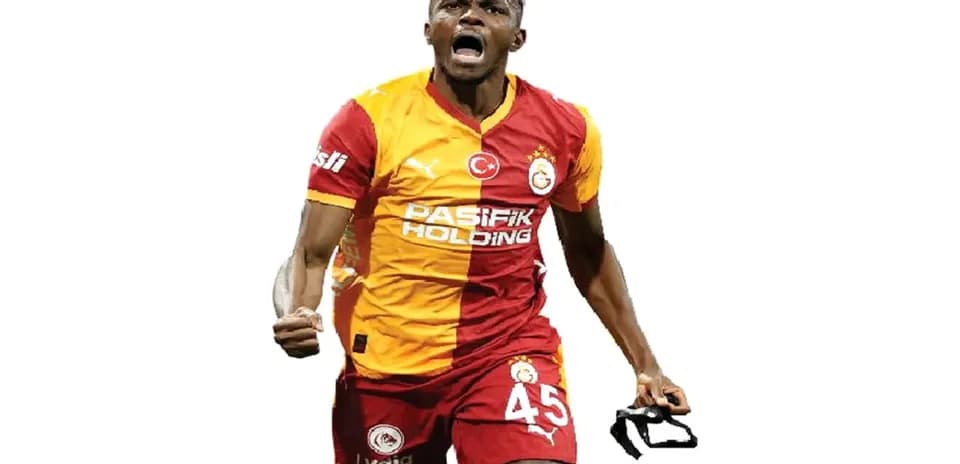 Player celebrating with jersey after scoring a goal