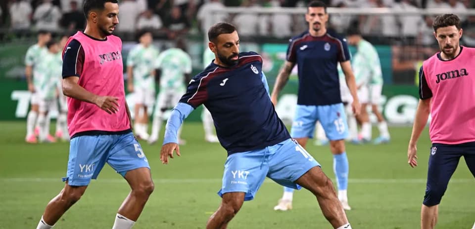 Players warming up before the match on the pitch