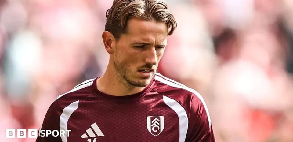 Player in Fulham kit during warm-up session