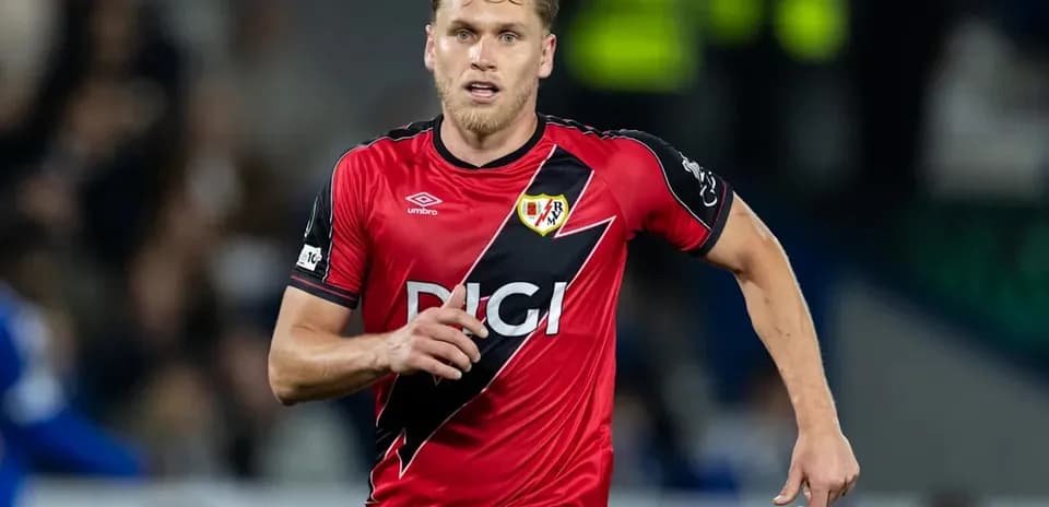 Player running in red jersey during match