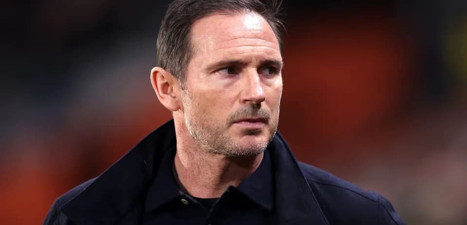 Coach observing during a match on the sidelines