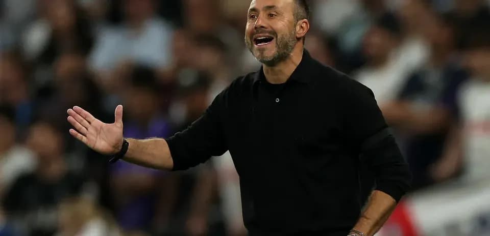 Coach gesturing during match on the sidelines