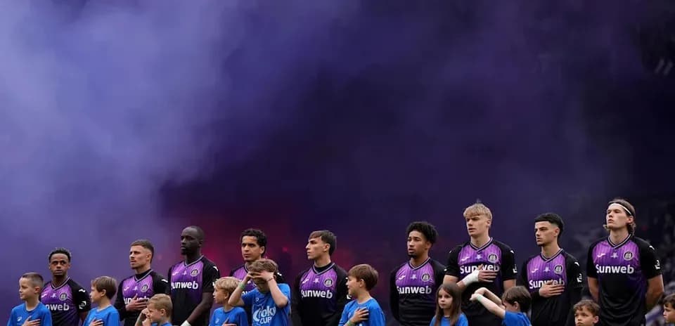 Players and children standing during pre-match ceremony
