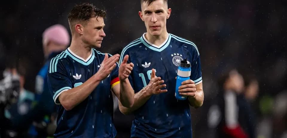 Two German players talking after a match