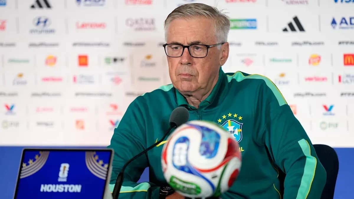 Manager at press conference with soccer ball