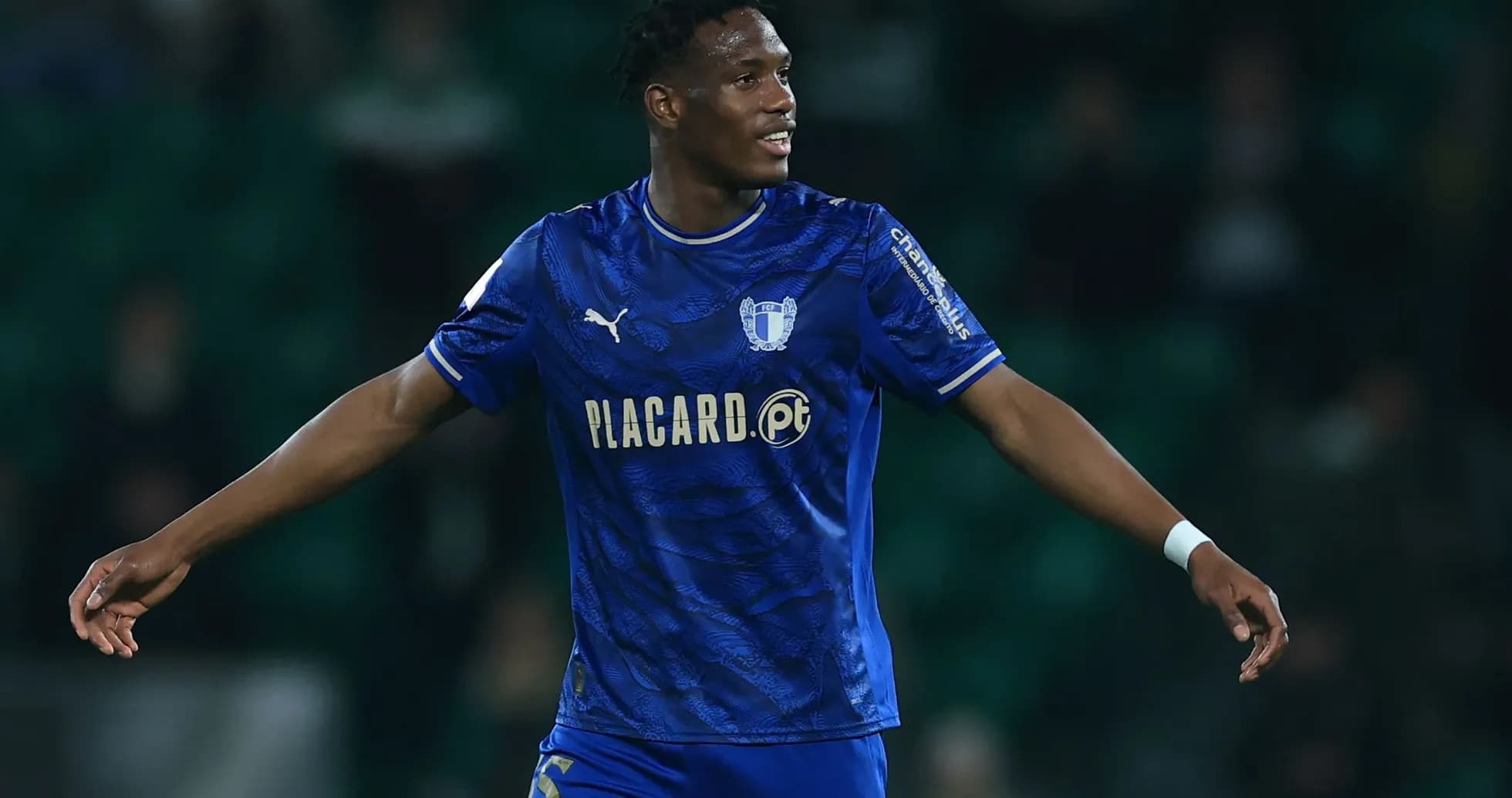 Player celebrating in blue jersey during match