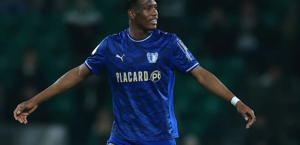 Player celebrating in blue jersey during match