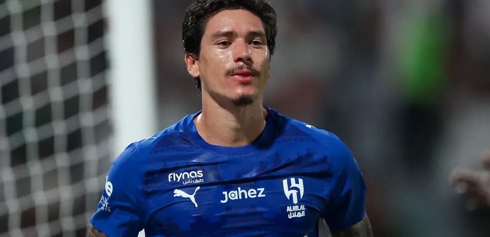 Player in blue jersey celebrating on the field