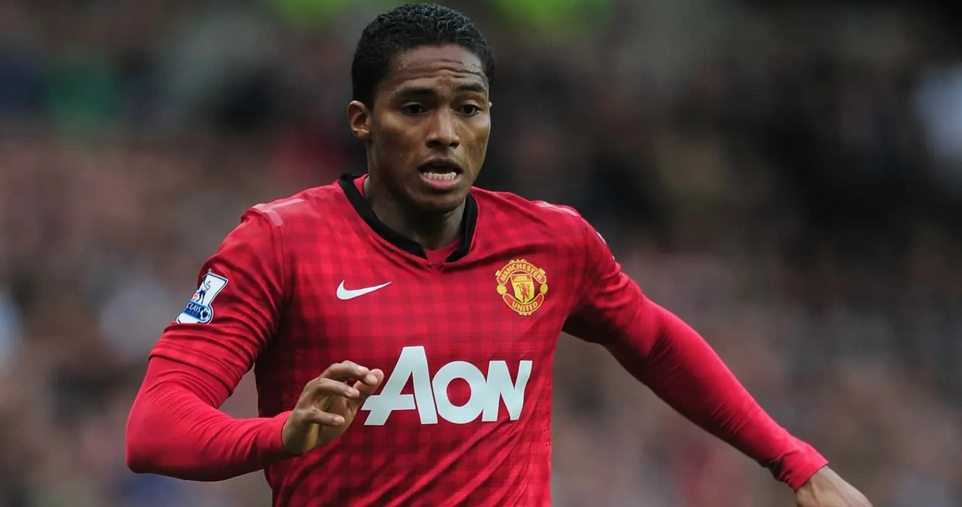 Player running on the field in Manchester United kit