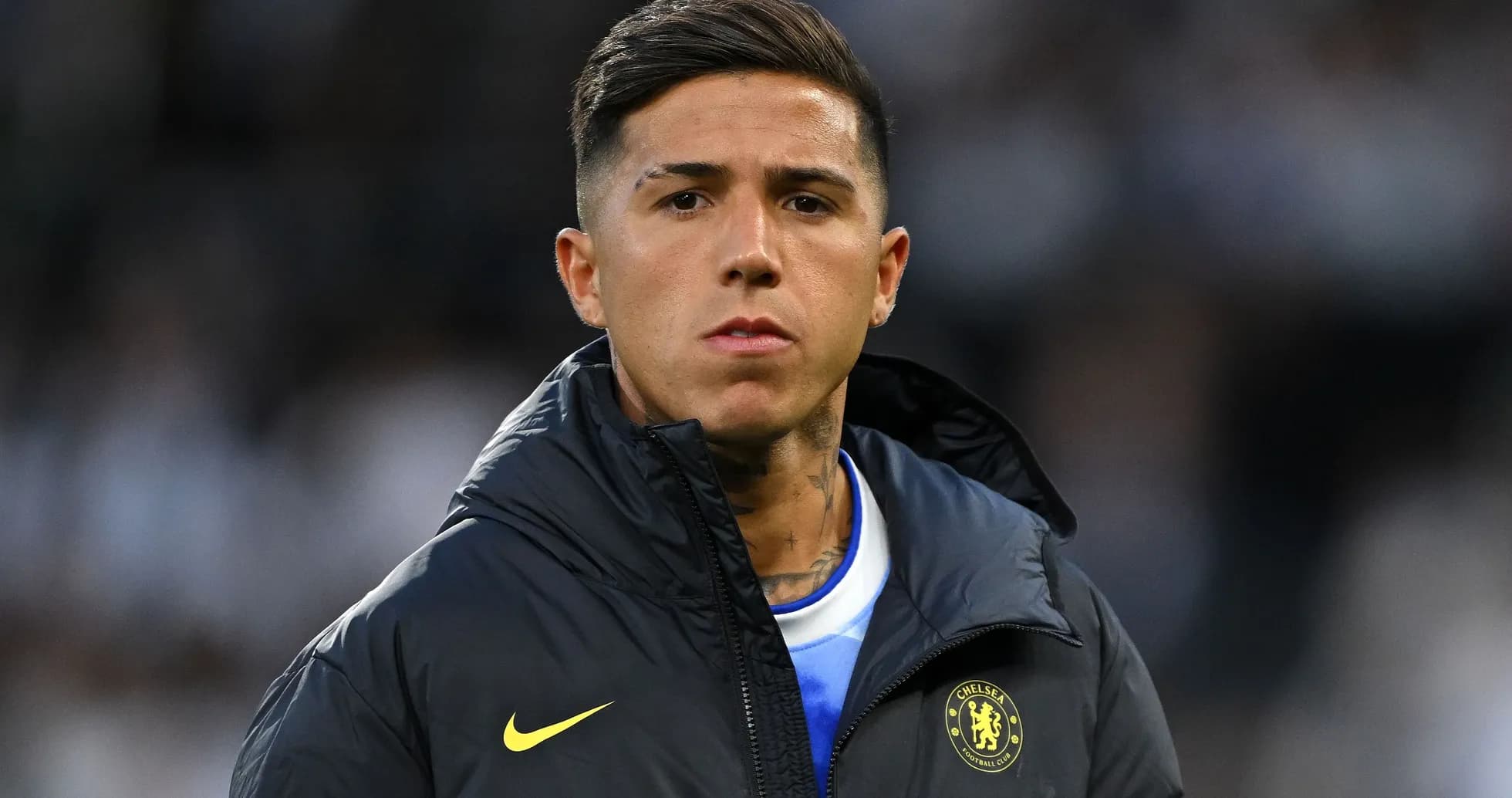 Player in Chelsea jacket before the match