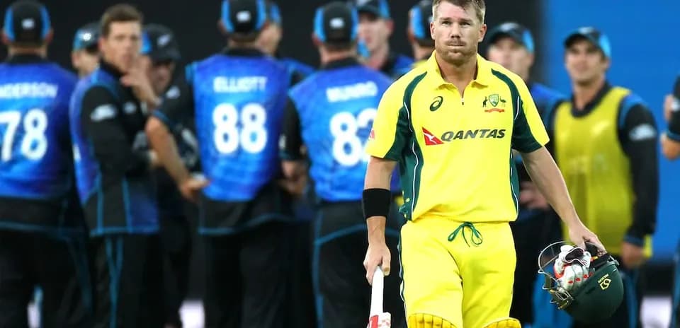 Australian player walking past New Zealand team celebration