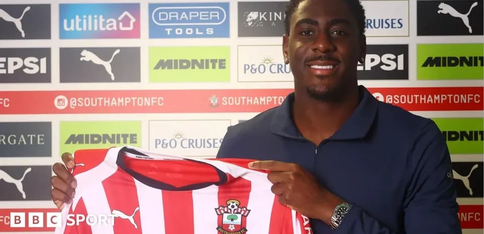 Player holding Southampton FC jersey during signing event